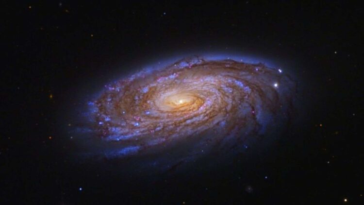 Hubble catches a spiral galaxy losing its star-forming fuel on a slow, one-way trip through the Virgo Cluster 1 Credits: ESA, NASA