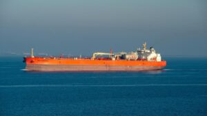 A supertanker left a Venezuelan port carrying about 1.8 million barrels of oil, and the shadow trick it used to fool maritime trackers reveals a hidden ocean that nobody was watching 27 shadow fleet supertanker seen from low angle on open ocean at dusk, venezuelan port carrying