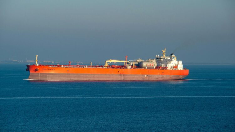 shadow fleet supertanker seen from low angle on open ocean at dusk, venezuelan port carrying