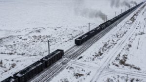 A radio link replaced the steel couplers between 7 loaded coal trains crossing Inner Mongolia, and the virtual coupling holding them in formation is calculated to lift the line's capacity by more than half 29 A Coal trains running close together under virtual coupling in snow