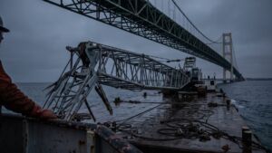 A crane boom crossing under the Mackinac Bridge stood 162 feet above the water with 153 feet of clearance, and nobody on the job had put an instrument on it 6 Collapsed crane boom on deck barge beneath the Mackinac Bridge after crane boom Mackinac Bridge strike, crawler crane boom
