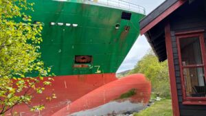 A 443 foot container ship grounded within yards of a cabin on the Trondheimsfjord shore, and the shipping company says the same vessel had run aground twice in the previous two years 21 443-foot container ship grounded on the Trondheimsfjord shore beside a small wooden cabin