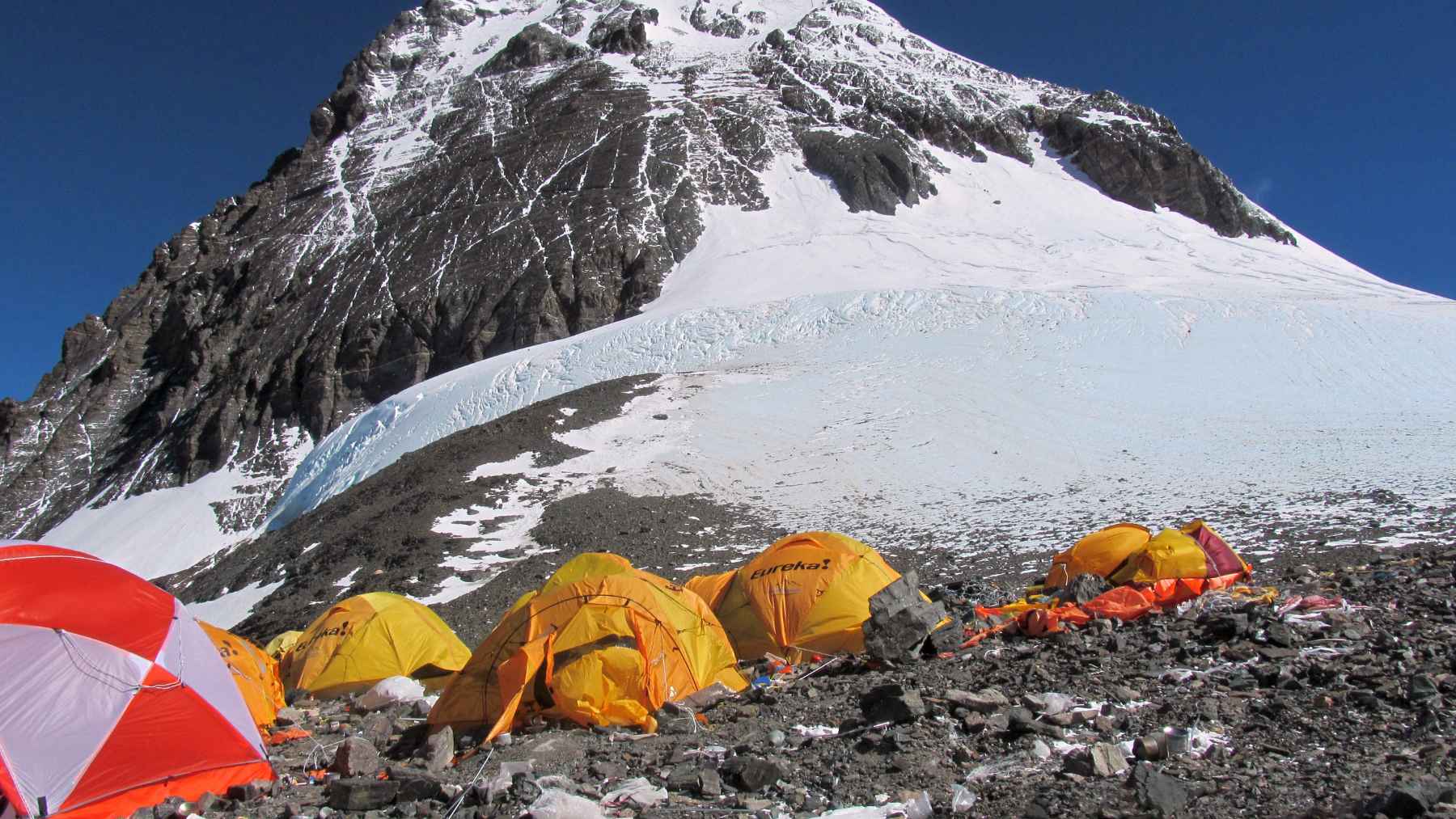 A 253 torr reading on the summit of Everest is the whole reason ambient air works up there, but the textbook atmosphere puts that number 17 torr lower and makes the climb impossible 1 Glacier goggles at a yellow tent door in ambient air
