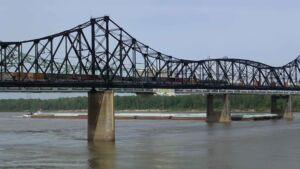 A towboat with 22 barges lost every rudder approaching a Mississippi bridge and the hydraulic pump that failed was never the problem, where the steering was lost during the attempt to fix it 39 Vicksburg bridge