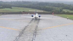 An Embraer carrying 53 people touched down long on a 5,810-foot runway in heavy rain at a Virginia airport, and a bed of crushable concrete blocks stopped it short of a highway embankment 43 Regional jet gear embedded in crushable concrete EMAS blocks at Roanoke runway end