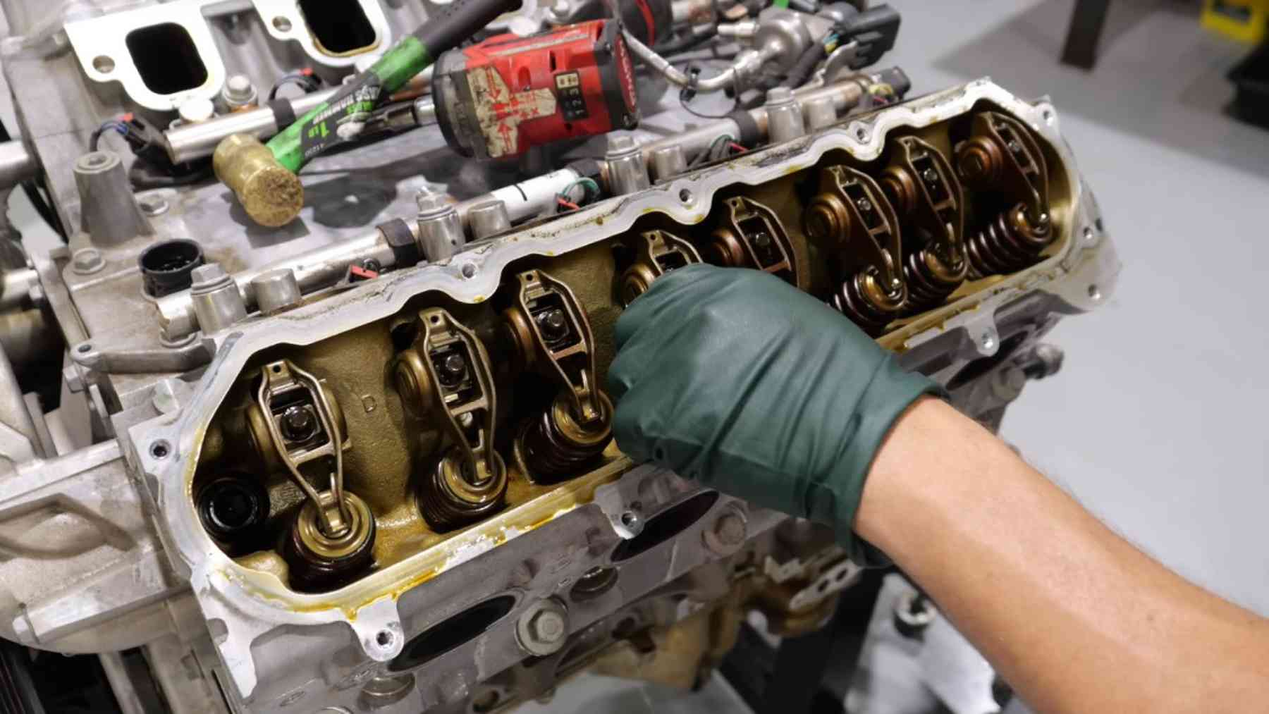 Nearly 1 million full size trucks and SUVs were told to run thicker oil instead of getting new engines, but the failures kept arriving and the regulator has logged hundreds of them since the repair 1 scored GM engine bearing on workshop bench, engine bearing recall investigation, full size trucks