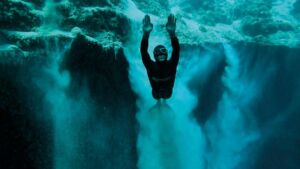 Riding a weighted sled off a Greek island took a diver 702 feet down on one breath and he came back up fine, but the deeper dive he made 5 years later put him in a hyperbaric chamber 50 Freediver gripping a weighted sled before a deep lung compression dive off Greece, single breath off