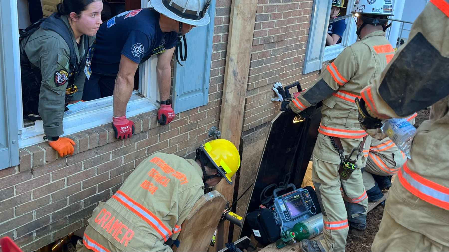 A trench collapse left a utility worker chest deep in dirt 13 feet under a Potomac house, where the fastest way to reach him ran sideways through a basement wall instead of down 1 A utility worker stood chest deep in dirt 13 feet under a Potomac house