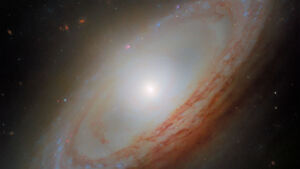 Hubble images spiral galaxy with blue arms, smooth core and active star-forming regions 41 Hubble found a blue armed spiral galaxy whose arms curl outward like a wave that never reaches the shore leaving