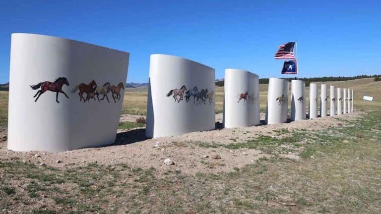 Upright snow fence panels cut from a fiberglass turbine blade