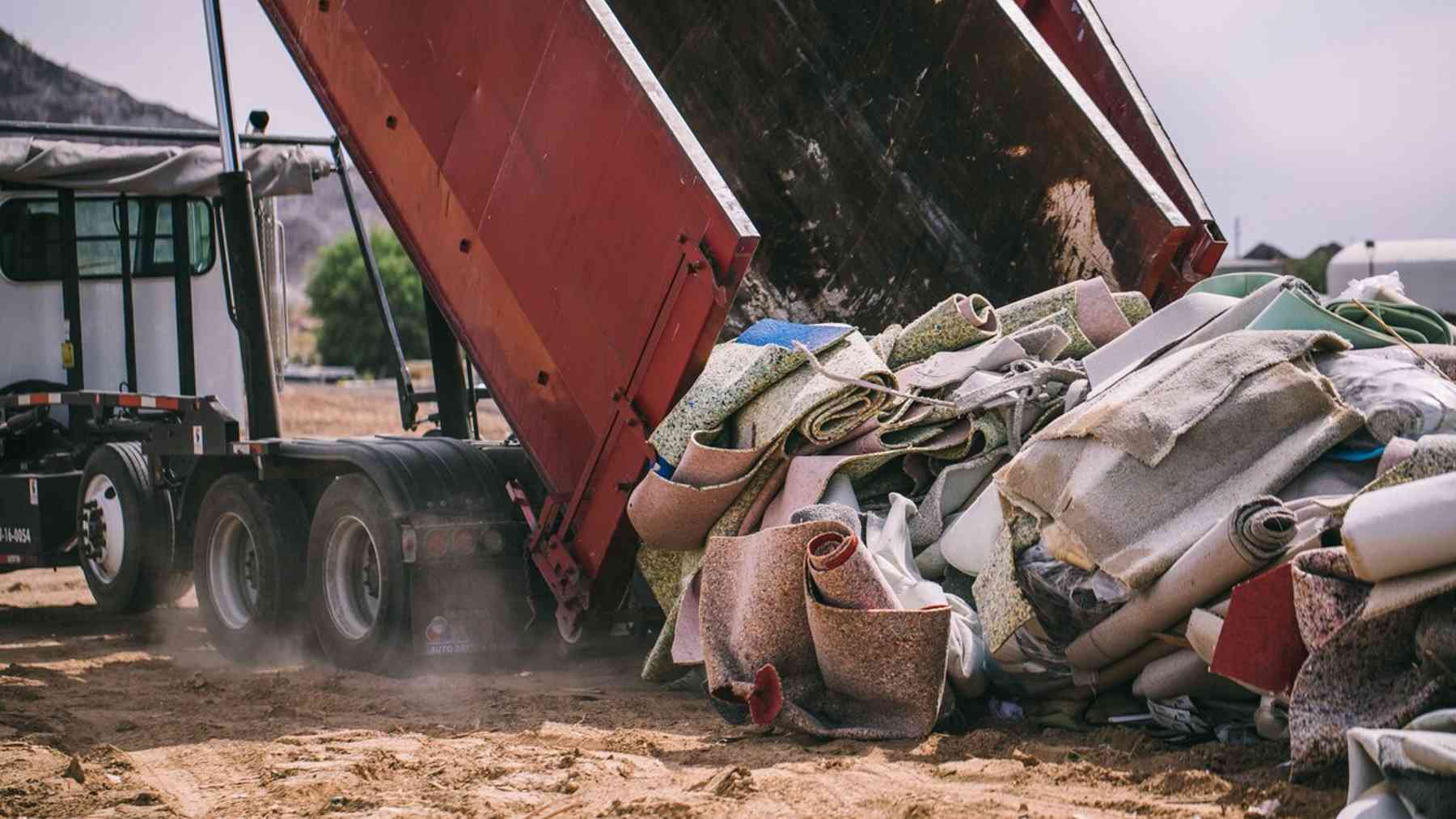 Around 5 billion pounds of old carpet go into American landfills each year, and the thin latex layer glued to the backing is what keeps the nylon above it out of standard recycling lines 1 cross section of old carpet showing nylon fiber and latex backing at a carpet latex recycling facility, around 5 billion