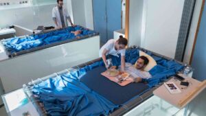 Five healthy men in 3 days of a weightlessness tank showed liver fat up 21 percent, and post-meal insulin climbed 90 percent while muscle and fitness also slipped 29 Volunteer floating in a water bath weightlessness dry immersion tank at a clinical research facility, five healthy men