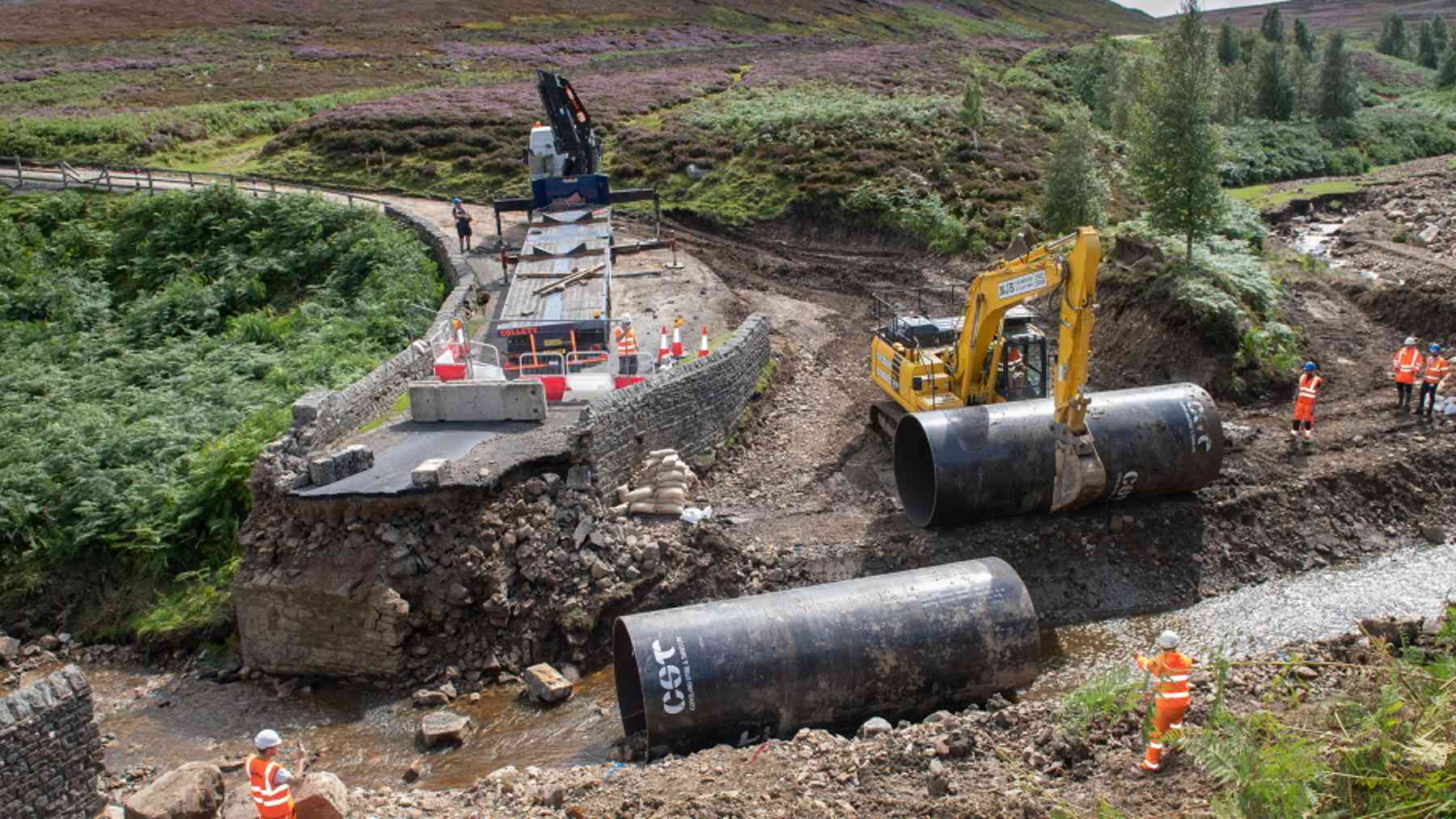 Floodwater tore out a stone bridge in the Yorkshire Dales overnight, so crews rolled in two 20 foot steel tubes built for a scrapped wind farm 1 Wind farm steel tubes rolled into a flooded Yorkshire Dales stream as an emergency bridge, floodwater tore out