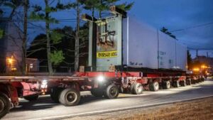 A mill generator weighing more than 683,000 pounds crawled across Maine from Jay to the coast over a week of overnight moves, crossing bridges only after crews laid temporary steel beams across them 2 Steel jumper bridges carrying an oversized generator load across a Maine bridge at night, mill generator weighing