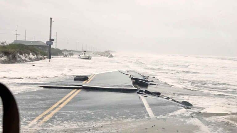 Ocean waves washing across North Carolina's Highway 12 during a nor'easter, ocean overwash shut