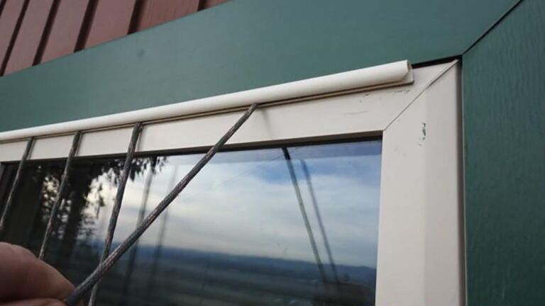 Dark paracord curtains hanging outside a window to cut bird strikes, pennsylvania father spaced