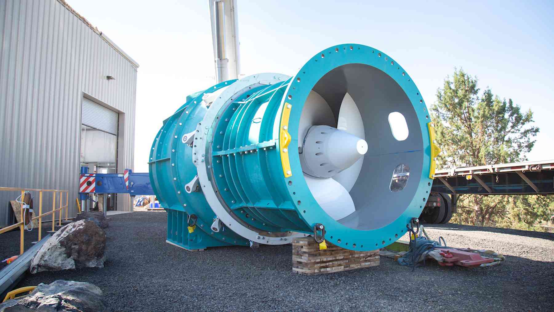A steel platform stands on three piles in a Massachusetts canal, and it tests tidal turbines in real ocean currents for about $30,000 a day 1 Tidal turbine testing platform lifting a turbine from the Cape Cod Canal, steel platform stands