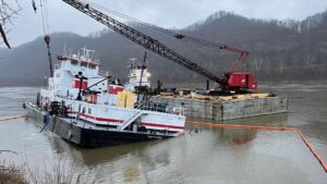 A towboat pushing fifteen barges eased toward an Ohio River bank to let a bigger tow pass, and it grounded on a stone jetty hidden under 19 feet of water 4 Towboat pushing barges on the Ohio River strikes a submerged stone jetty, towboat pushing fifteen