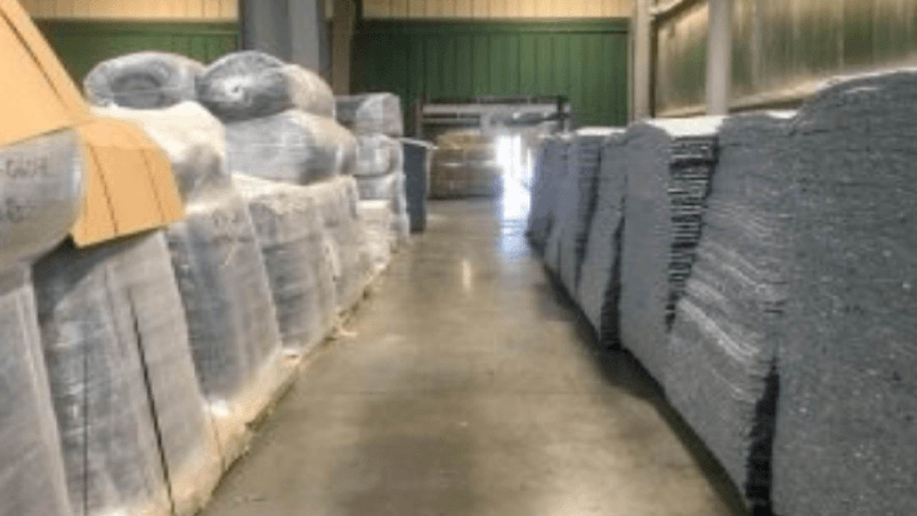 A worn pair of jeans goes onto a conveyor belt at an Arizona plant, and it comes out as insulation lining walls in homes across the country